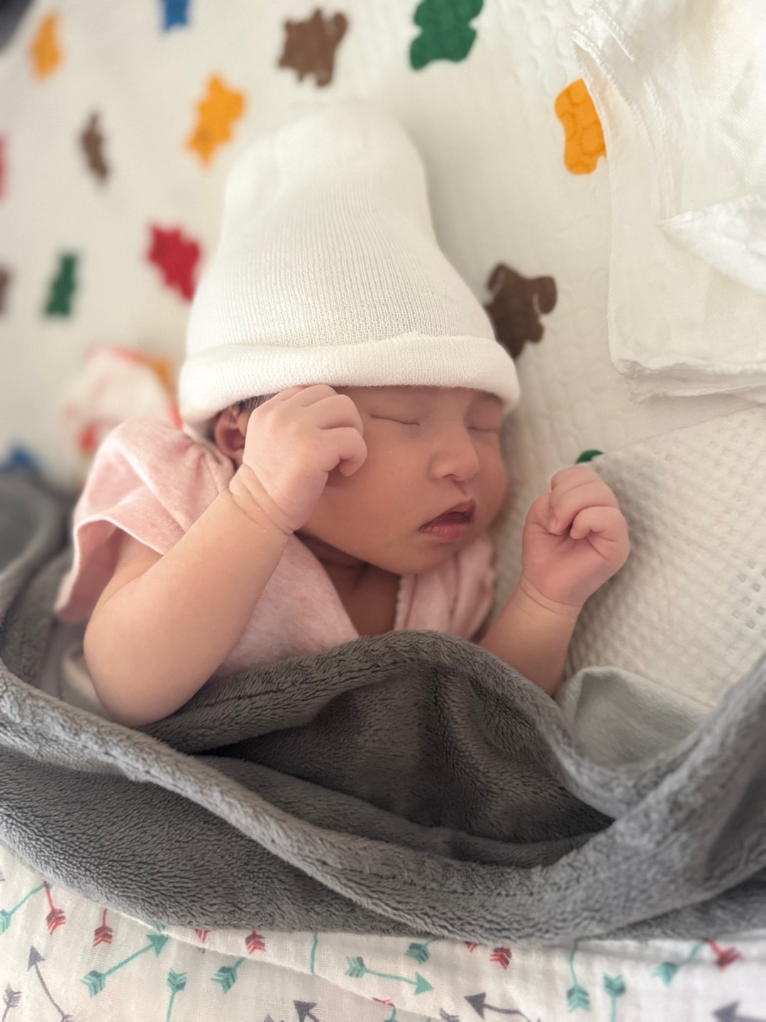 At some point, she started to stretch her arms (and also the legs to some degree). But she was so small and could not even maintain her body temperature well without the beanie. 